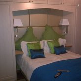  Padded headboard with matching cupboards