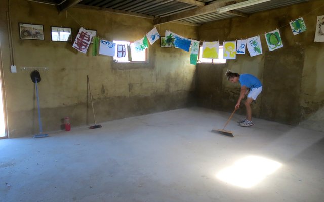 Clayden Burger preparing the concrete before painting