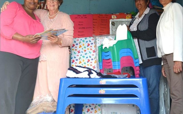 Overstrand Mayor Nicolette Botha-Guthrie (2nd left) seen handing over gifts of books, tables, chairs, blankets and winter clothing recently for the  young  children  in  the care of Princess Ndude (1st ) owner and educator of Zisabantu Educare Centre in Zwelihle. Looking on are Cllrs Moira Opperman (2nd right) and Mercia Andrews (1st right). â€œI am so happy. This will really help us to provide a better service and improve the facility. The children especially will benefit the most from these amazing  goods,â€  stated  an  emotional Ndude, who holds certificates in Level 4 and Level 5 Early Childhood Development (ECD) training obtained through Boland Collage. 