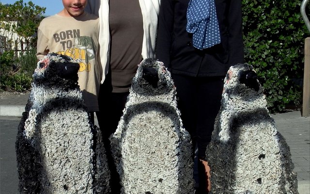Christopher Nimb (8), Sylvie Agenbach and Tahlia Nimb (12) after re-painted the previous â€œFees van die Ganseâ€ African Penguins for the festival.