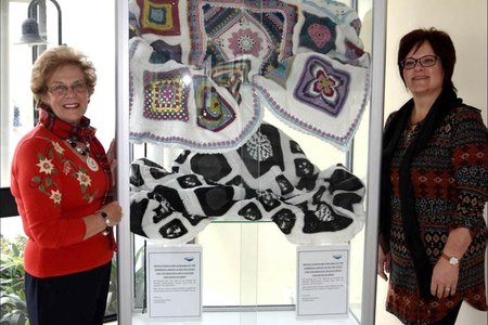 The spectacular multicoloured and black and white blankets that have been crocheted by Estrellita Engelbrecht and Jane Langenhoven and their respective teams of ladies from the â€œHooked on Tuesdayâ€ Club are currently  on  display in the glass cabinet in front of the Hermanus Library. For those wanting to partake, raffle tickets are available at the Hermanus Library at a cost of R50 each for the multi-coloured blanket and R30 each for the black and white one.  Executive Mayor Nicolette Botha-Guthrie and Councillorsâ€™ Secretary Doret Taljaard pictured with the two specially handcrafted crocheted blankets that will be raffled to raise funds for various projects under the banner of the Nicolette Botha-Guthrie Charity Fund. 