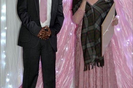 Overstrandâ€™s Director of Economic Development, Mr. Solomzi Madikane seen receiving a long-service award from Executive Mayor, Alderlady Nicolette Botha-Guthrie  at the Councillors  End-of-Term  Farewell  Dinner.