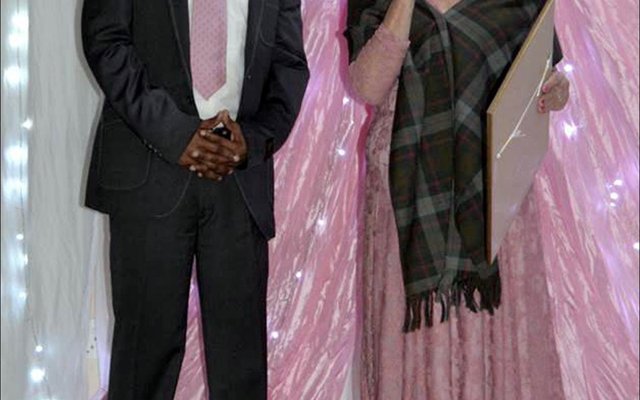 Overstrandâ€™s Director of Economic Development, Mr. Solomzi Madikane seen receiving a long-service award from Executive Mayor, Alderlady Nicolette Botha-Guthrie  at the Councillors  End-of-Term  Farewell  Dinner.