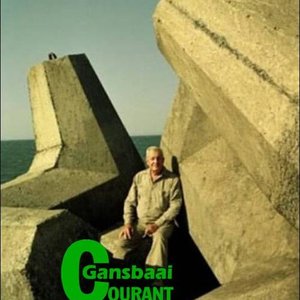 â€˜n Trotse Aubrey Kruger, ontwerper van die dolos, sit hier in Oos-London hawe tussen sy uitvindsels.