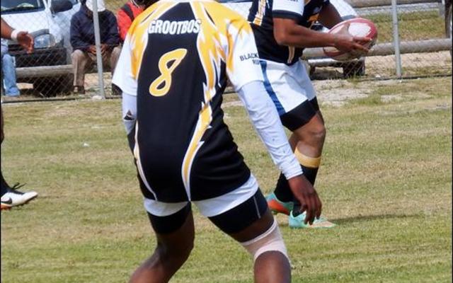 Die spanne van Black Leaves 1 (Gansbaai) en Elim in hulle uitspeelwedstryd kort voor die einde van die 7â€™s Rugbytoernooi, waar Black Leaves 1 met 57-5 gewen het.