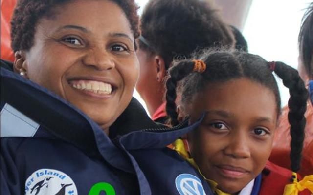 Pinkey Ngewu, organiser of the competition, on Dream Catcher during the boat trip for the competition winners, with Dederei Johnson next to her.