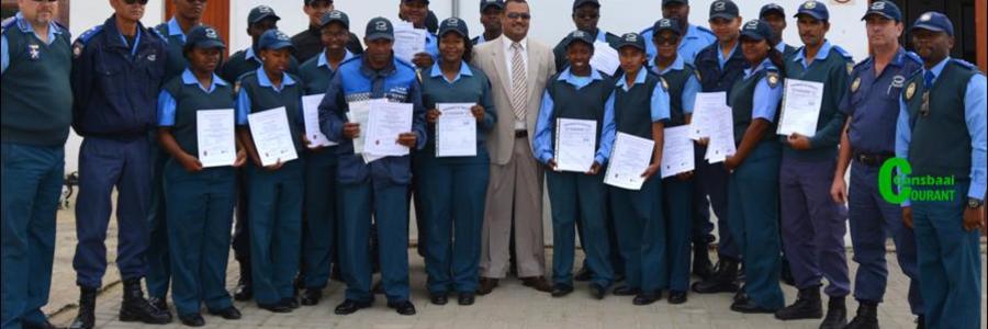 Director of Protection Services, Neville Michaels (centre) was recently pictured at a certificate handover ceremony where Law Enforcement officials were awarded certificates for completing courses in Fire Arms Training, Security and Skipperâ€™s License.