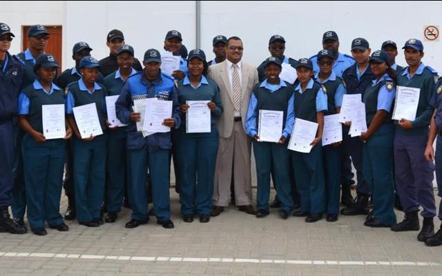 Director of Protection Services, Neville Michaels (centre) was recently pictured at a certificate handover ceremony where Law Enforcement officials were awarded certificates for completing courses in Fire Arms Training, Security and Skipperâ€™s License.