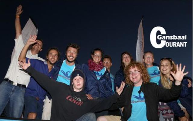 The final count down â€¦ 3, 2, 1 â€“ and the townâ€™s Christmas Lights were switched on.  Above are voluntary workers from Marine Dynamics making the most of this festive event in Gansbaai.  They were part  of  the  procession  through the streets.  These  young  people  represent countries from all over the world.