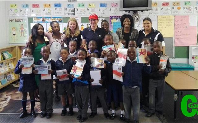 The Masakhane group of swimmers, receiving their well earned certificates from workers at the Grootbos Foundation.  