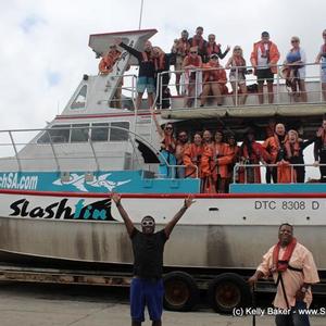 The actor and comedian, Tracy Morgan shows his excitement about the  forthcoming shark diving trip in front of the boat â€œSlashfinâ€. His brother, Jim (right) joined him.