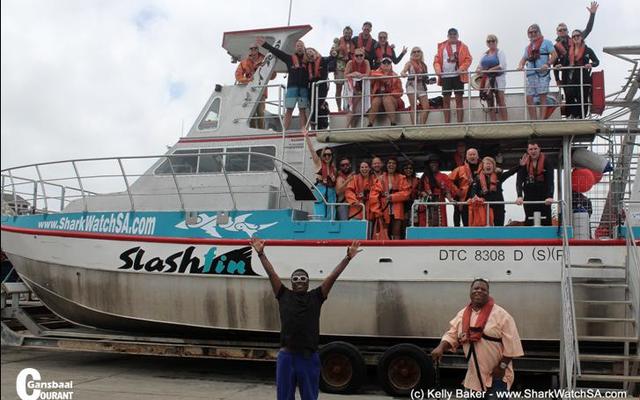 The actor and comedian, Tracy Morgan shows his excitement about the  forthcoming shark diving trip in front of the boat â€œSlashfinâ€. His brother, Jim (right) joined him.