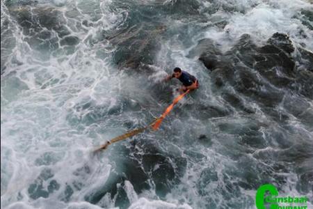A moment in action while a crew member of NSRI is in a process of rescueing a rubberduck at sea. 