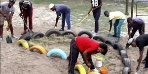 A team from Grootbos Foundationâ€™s Food Security project busy to beautify  Strandlopertjie for their  television appearance this week.  In front is Anchelle Damon, from the Grootbos Early Chilhood Development Programme, with - from left:  Pontsho Chiloane, Vuyo Khonkco, Olwethu Sikhotshi, Lindile Xabenolini, Odwa Khutshwa, Zuko Mlonyeni and Luyanda Pinikiso. 