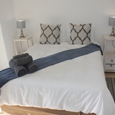 Double bed room en-suite leads out onto patio