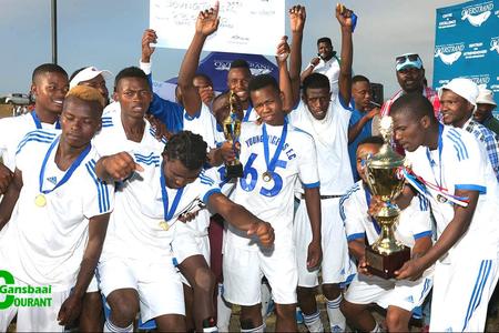 Stanford Young Tigers FC pump their fists in the air in exultation and hold the winning trophy and cheque aloft with great pride after being crowned the undisputed winners in Saturdayâ€™s soccer grand finale.
