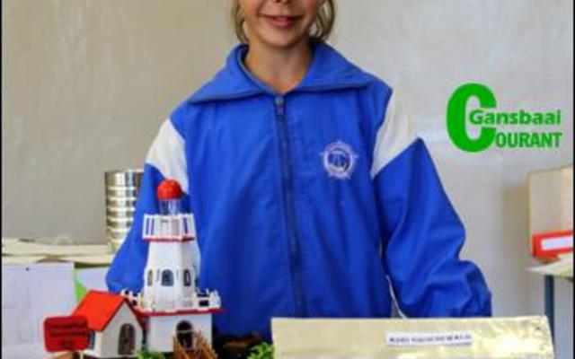 Adri Groenewald het â€˜n hele dorpie ingehandig met dolosse op die voorgrond, die Danger Point Ligtoring en die Strandveld Museum.Â  Sy het Glenda Kitley, bestuurder by die Gansbaai Toerisme kantoor, gekies om â€˜n onderhoud mee te voer.