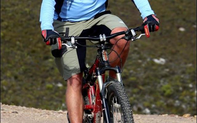Well known dentist and enthusiastic mountain bike rider from Gansbaai, Corrie Loubser slows down at the top of the scenic Farm 215.  He was the sweeper at Saturdayâ€™s race.