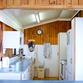 A practical kitchen situated close to the lounge and dining room area ...within conversation distance from the family and friends