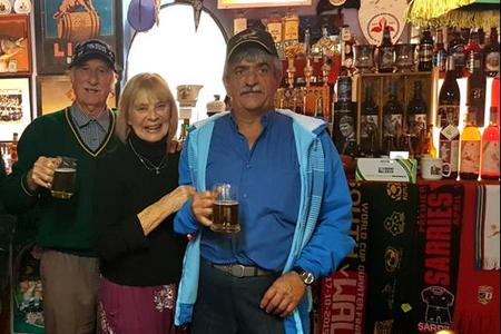 Banie van den Berg (right) was one of the privileged guests  at David Macdonaldâ€™s (left) private rugby museum.  They enjoy one of the many rare craft beers which was served by the host.  Davidâ€™s wife, Margaret served a splendid five course meal in their cosy, historical dining room.