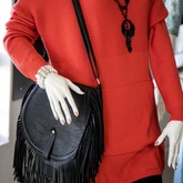Fashionable red blouse with black handbag