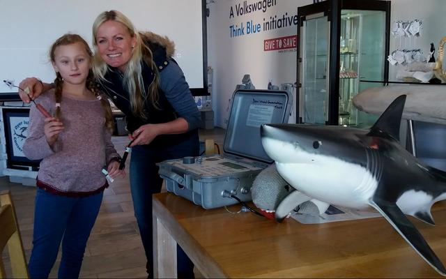 Nicole Schutte with shark biologist, Alison Towner, showing the DEEP students the equipment used in tagging and tracking white sharks.