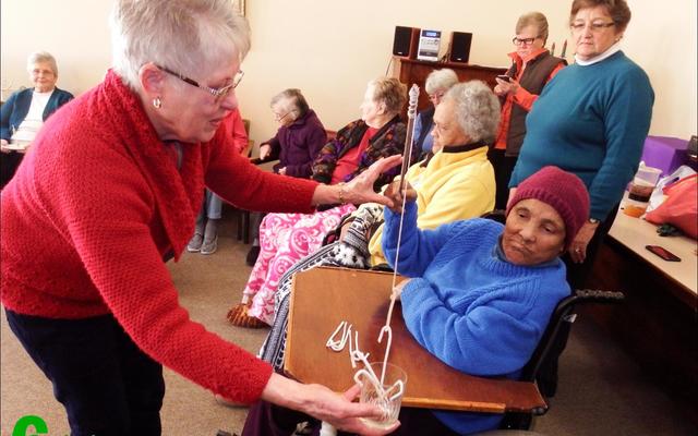 Emma Appel is baie in haar skik met die vis wat sy uitgetrek het â€“ rolstoel en al!