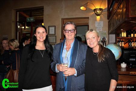 A joyful moment for Kelly Baker (left), Marine Dynamics: Marine biologist and Alison Towner (right), Dyer Island Conservation Trust: White shark biologist, with Richard Peirce, author of the book, â€˜Nicoleâ€™ - A true story of a white sharkâ€™s journey.