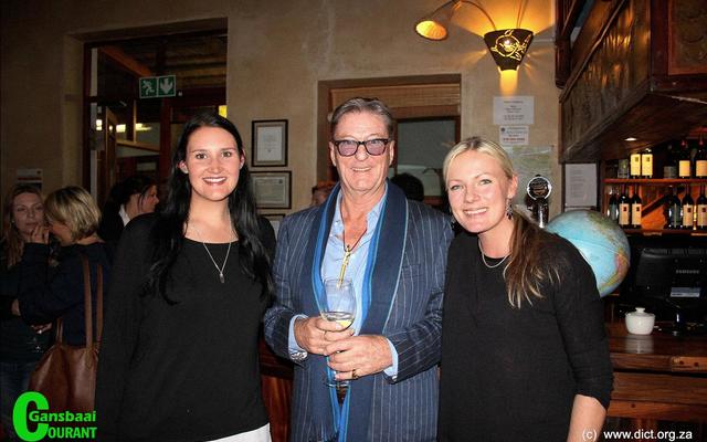 A joyful moment for Kelly Baker (left), Marine Dynamics: Marine biologist and Alison Towner (right), Dyer Island Conservation Trust: White shark biologist, with Richard Peirce, author of the book, â€˜Nicoleâ€™ - A true story of a white sharkâ€™s journey.