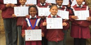 The  Marimba band of Okkie Smuts Primary School recently won the Overberg Eistedfodd primary school section with 95% (Cum Laude). Back from left: Damian van Heerden, Jade Coetzee, Kia McKay, Nicole Dreyer and Nahum Plaatjies.  Middle: Erin Dreyer, Busisiwe Mhlontlo, Kelsey Montagu and Sade October.  Front: MichÃ© Damon and Kim McKay.