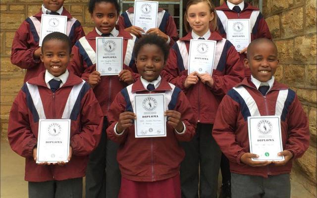 Overberg Eisteddfod Poetry from left. Back: Oyama Kosi (Green Poetry), Erin Dreyer (Silver Poetry)  and  Chantal  van  der Poll (Silver Poetry). Middle: Saydin Rooi (Silver Poetry) and Sarah Staples (Silver Poetry). Front: Likho Poni (Silver gedig), Nozipho Ngwenya (Silver Poetry) and Nipho Mcinjana (Green Poetry).