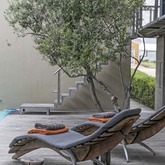 Tanning chairs outside by the pool