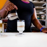 Staff preparing CaffÃ¨ lattes