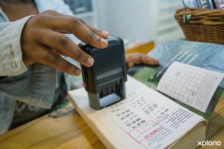 Kleinmond_public_library_checking_out_book_1530081664