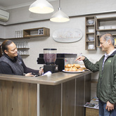 Customer buying croissants