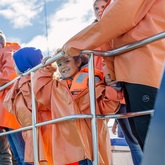 Child enjoying whale watching trip