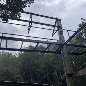 Solar panel walkway in tree canopy at Platbos