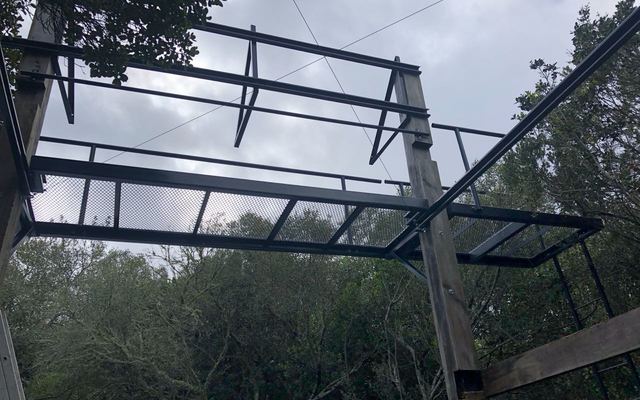Solar panel walkway in tree canopy at Platbos