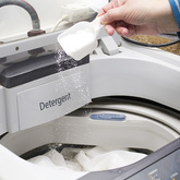 Adding soap to laundry
