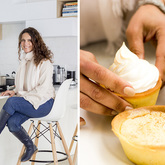 Owner at kitchen table moving cakes for display