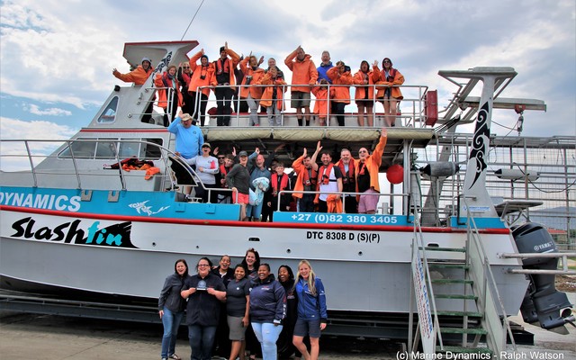 Marine Dynamics Team celebrating with clients