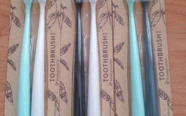 Toothbrush sets with biodegradable handle