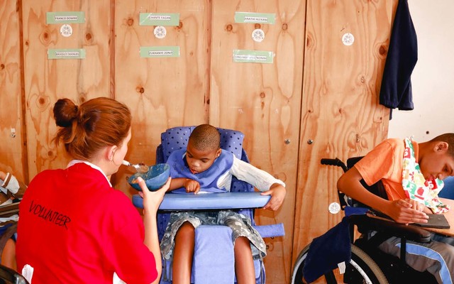 Elim_home_volunteer_feeding_child_1518417993_1573474963 Elim_home_volunteer_feeding_child_1518417993_1573474963