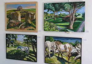 Photo of a wall of paintings