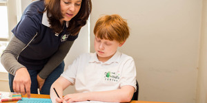 Butterfly_centre_teacher_helping_student_with_math_1528900588_1582209501