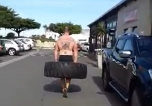 ManÂ Witnessed Carrying Tractor Tyre