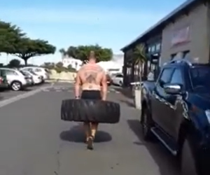 ManÂ Witnessed Carrying Tractor Tyre