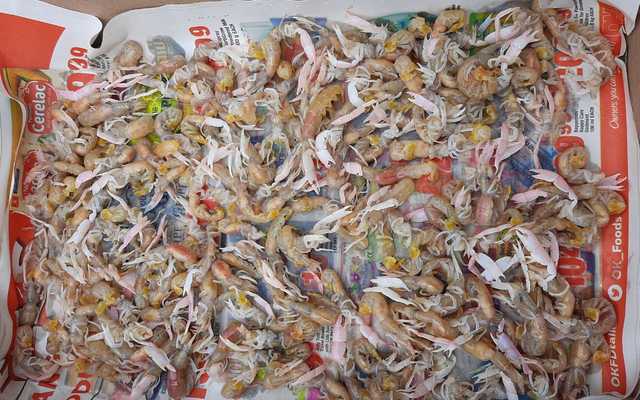 Pink prawns in newspaper