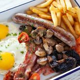 Xplorioâ„¢ Struisbaai - Catch Cook Restaurant - Skippers Breakfast (two free range eggs served with bacon, local beef boerewors, sautÃ©ed mushrooms, roasted cherry tomatoâ€™s and chips *bacon can be substituted with macon)