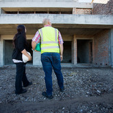 Inspecting Building Site
